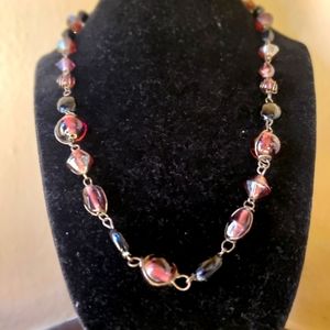 Beautiful Glass beaded necklace with deep purple (like grape) hues.  21"